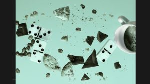 Falling dominoes, coffee, cookies, and chocolate symbolising how one small risk can trigger a chain reaction in business and take you through what an example of a risk management strategy is.