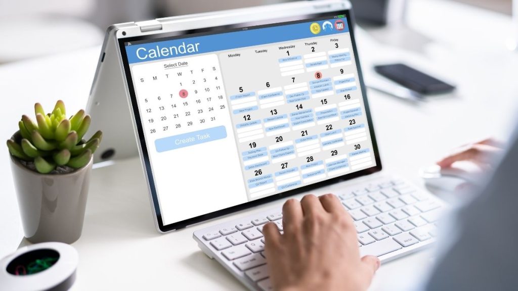 Digital calendar on laptop screen highlighting weekly project risk review schedule.