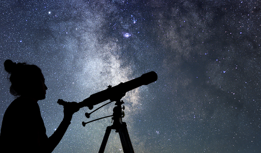 A telescope pointing towards a bright constellation, representing foresight in change management.